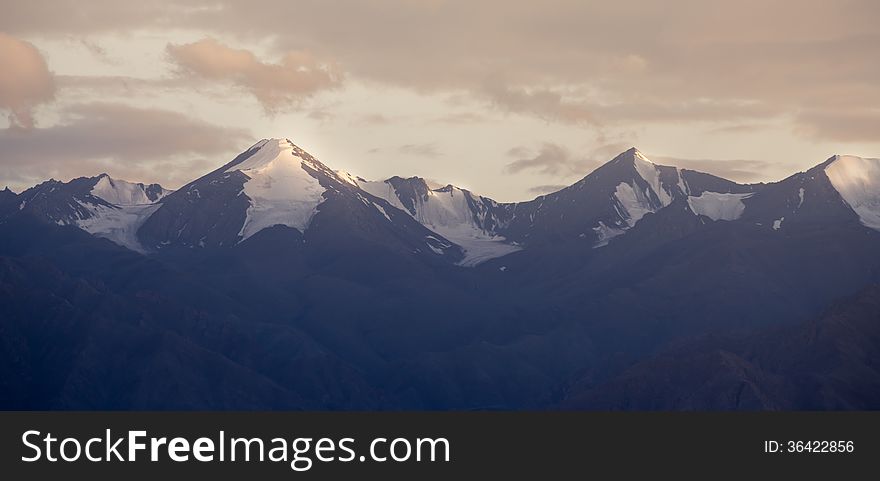 Panorama of snow mountain with light of sun set. Panorama of snow mountain with light of sun set