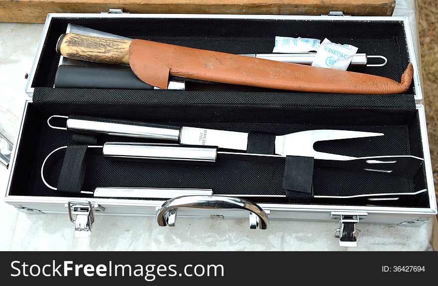 A professional knife, fork and BBQ clamp in an open tool box