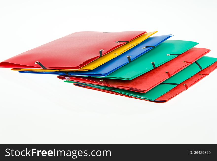 Colorful office folders on white background