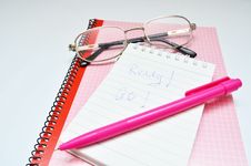 Pink Pen Notebook And Glasses Word Ready Royalty Free Stock Photo