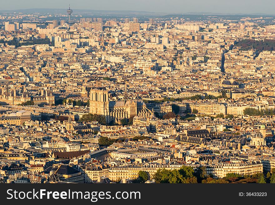 View of Paris from the Montparnasse Tower at sunset. Notre Dame de Paris in the center.