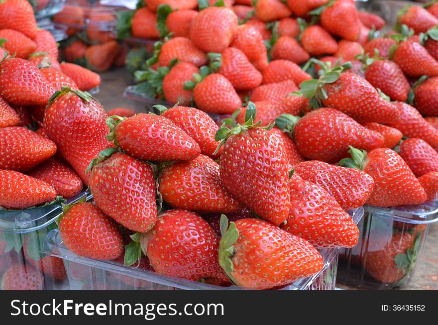 Market stand with fresh strawberries