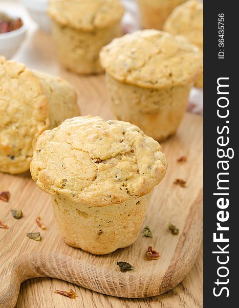 Snack muffins with dried peppers and onions close-up