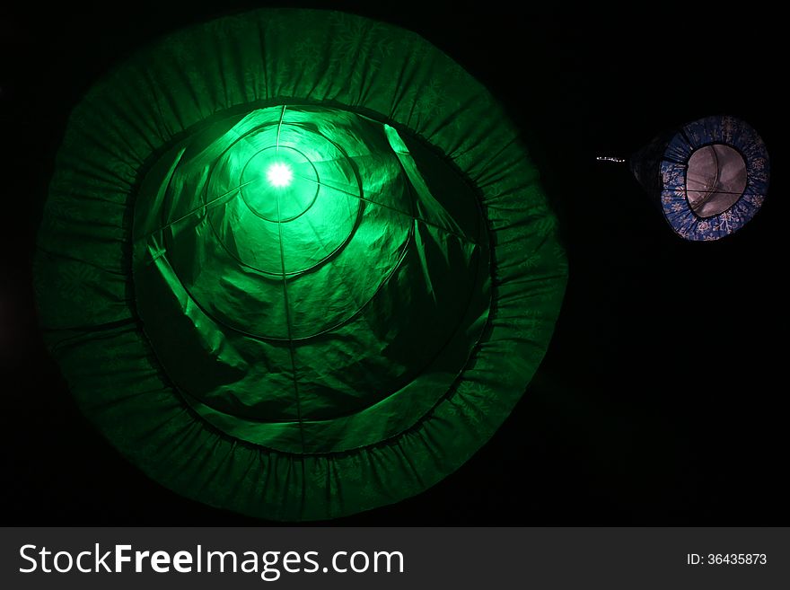 Green Christmas decoration symbolizing trees and lighted inside by stick led.