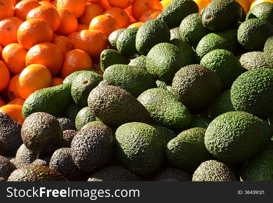 Market stand with fresh avocado