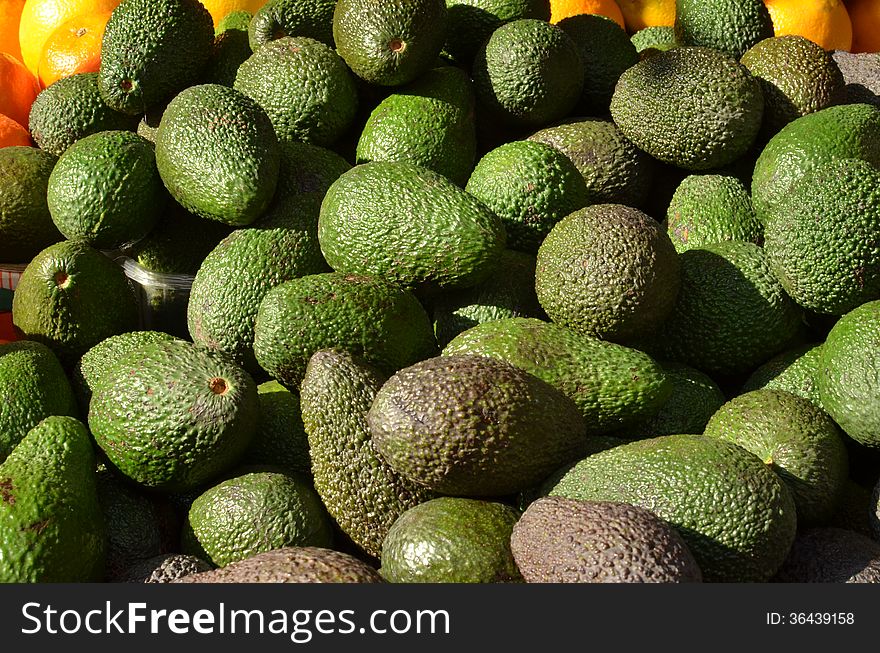 Market stand with fresh avocado