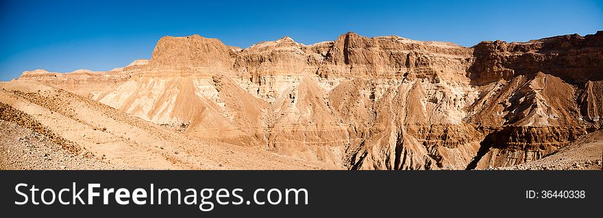 Wide panorama of stone desert mountains in Israel near Dead Sea. Wide panorama of stone desert mountains in Israel near Dead Sea