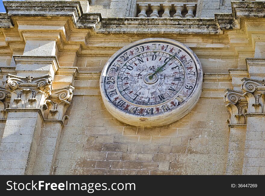 A calendar clock located on the facade of Cathedral is showing the day and date.
