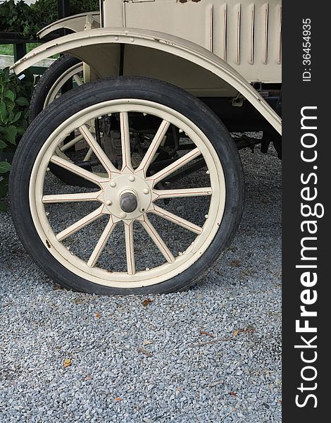 Antique truck wheel with spokes and fender. Antique truck wheel with spokes and fender.