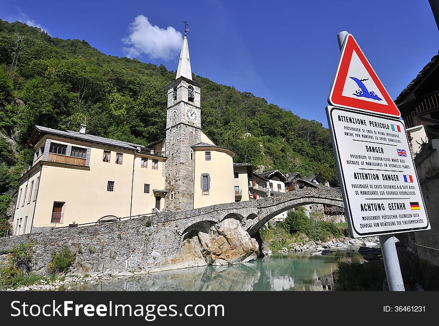 Roman bridge with church in Fontainemore, Aosta Valley, Italy