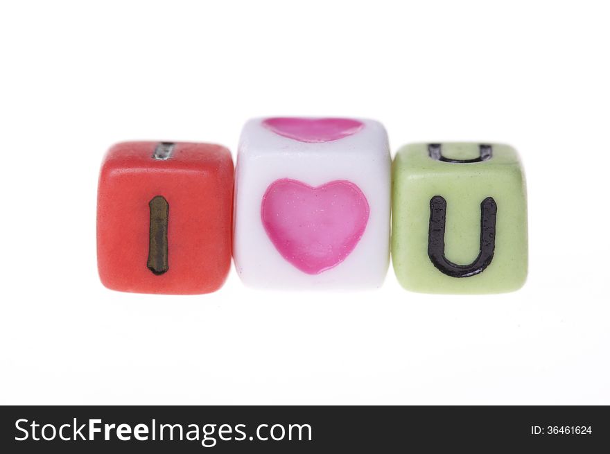 Colorful plastic cubes with I love you alphabets.