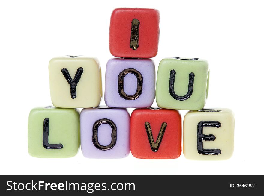 Colorful plastic cubes with I love you alphabets.