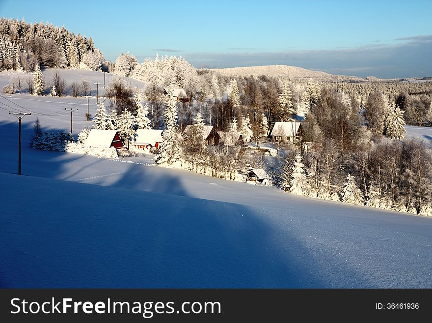 Scenic winter landscape with village. Scenic winter landscape with village