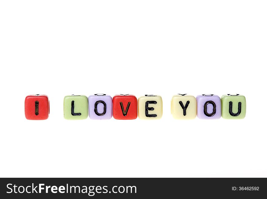 Colorful plastic cubes with I love you alphabets.