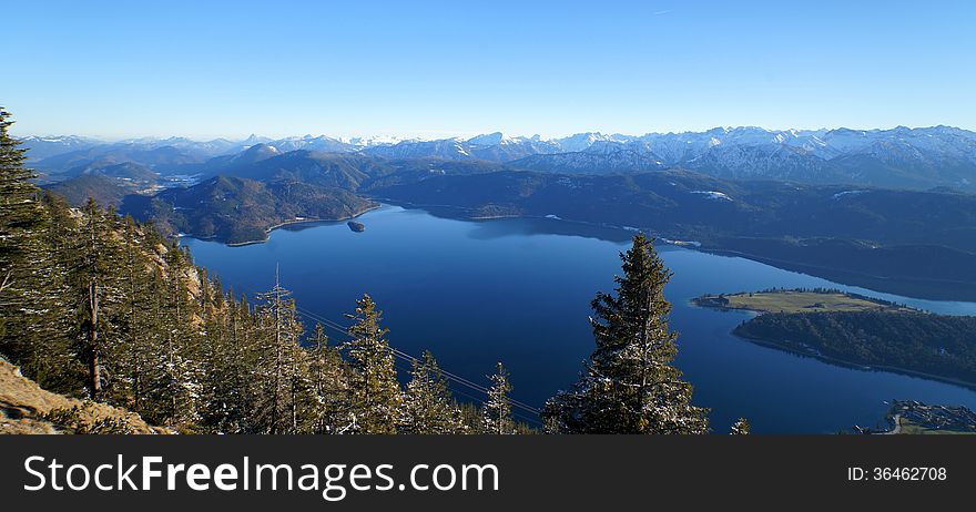 Lake Walchen as seen from Mount Herzogstand, Bavaria, with the Austrian Alps in the distance. Lake Walchen as seen from Mount Herzogstand, Bavaria, with the Austrian Alps in the distance.