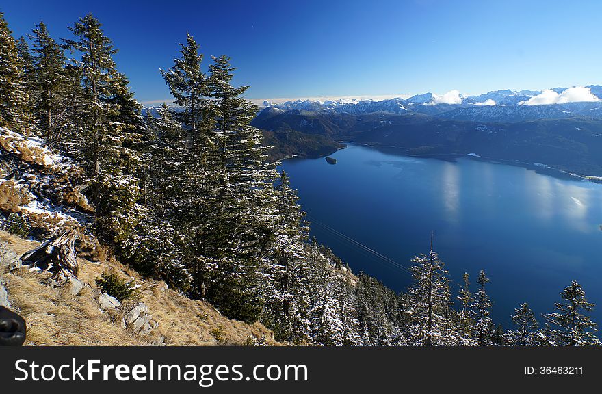 Lake Walchen as seen from Mount Herzogstand, Bavaria, with the Austrian Alps in the distance. Lake Walchen as seen from Mount Herzogstand, Bavaria, with the Austrian Alps in the distance.