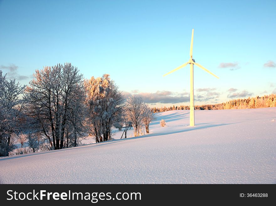 Stopped wind power plant in the winter landscape