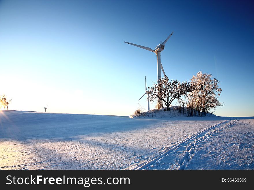 Wind turbines on snowy hill. Wind turbines on snowy hill