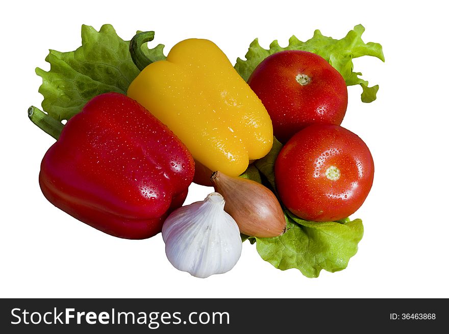 Fresh vegetables pepper, tomato, garlic, onions and green salad on a white background