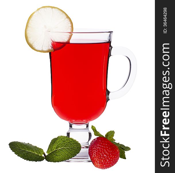 Cup of strawberry tea with mint and a lemon on a white background