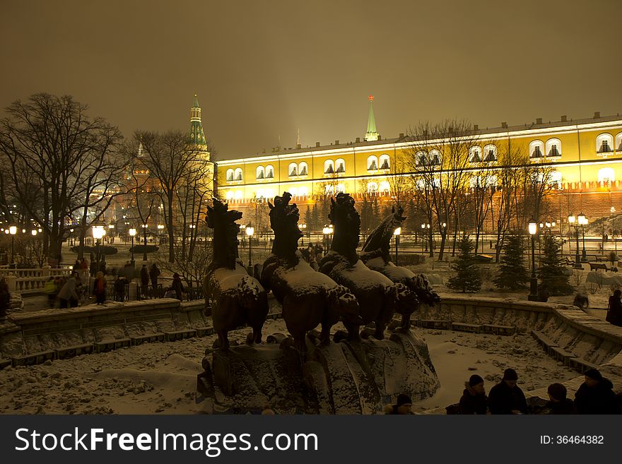 In Moscow winter, New Year. People go out in the Alexandrovsky garden near the Kremlin walls. In Moscow winter, New Year. People go out in the Alexandrovsky garden near the Kremlin walls.