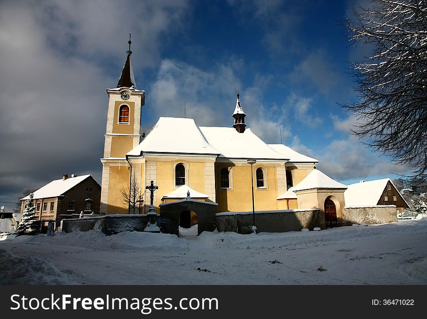 Yellow church in the winter day