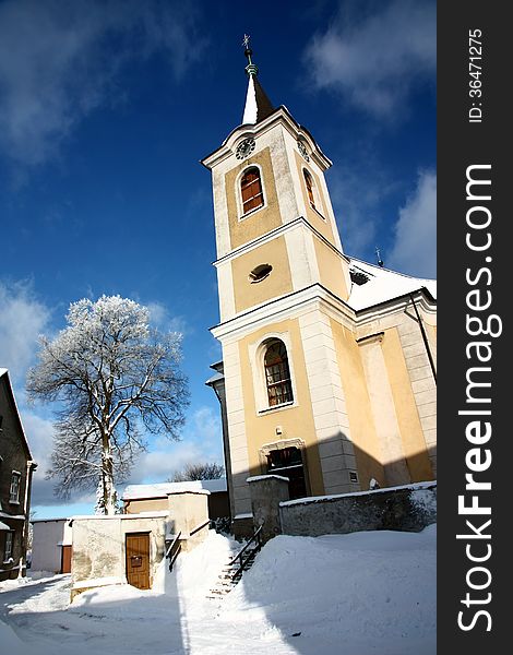 Yellow church in the winter day