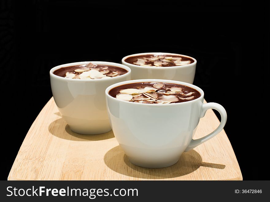 Chocolate mousse with almond in a white cup