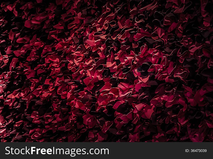 Red and black paper flowers adorn a wall in a building for Valentine's Day. Red and black paper flowers adorn a wall in a building for Valentine's Day