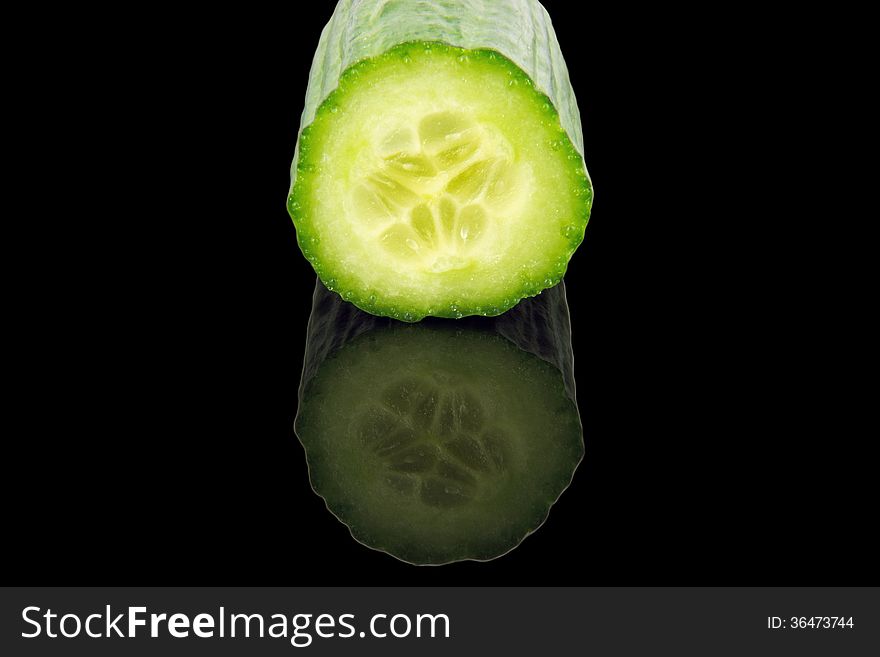 Cucumber cross section isolated on black background