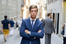 Attractive Young Businessman In Urban Background Stock Photo