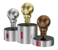 Golden, Silver And Bronze Light Bulbs On Cylindrical Pedestal Royalty Free Stock Image Golden, Silver And Bronze Light Bulbs On Cylindrical Pedestal Royalty Free Stock Image
