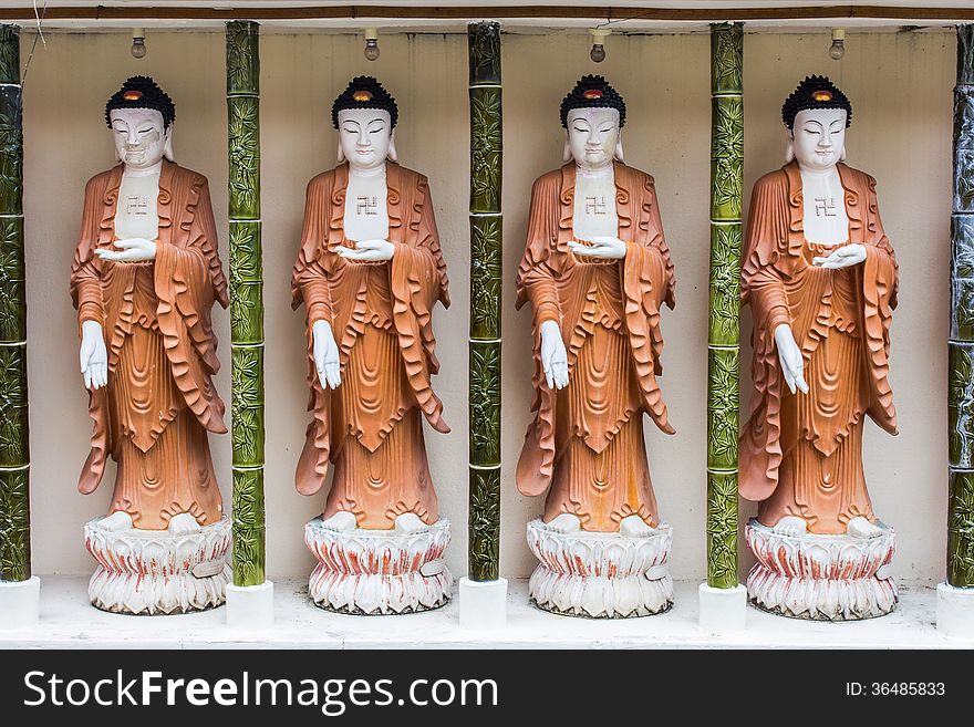 Four buddha statues at Penang's temple in Malaysia.