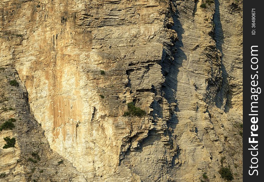 Huge sea rock formation by bright sunny day. Huge sea rock formation by bright sunny day