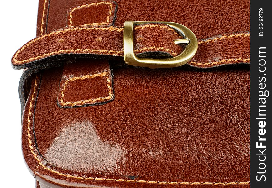 Details of Ginger Leather Traveling Bag with Pocket Bronze Rivet and Backstitch closeup on white background. Details of Ginger Leather Traveling Bag with Pocket Bronze Rivet and Backstitch closeup on white background