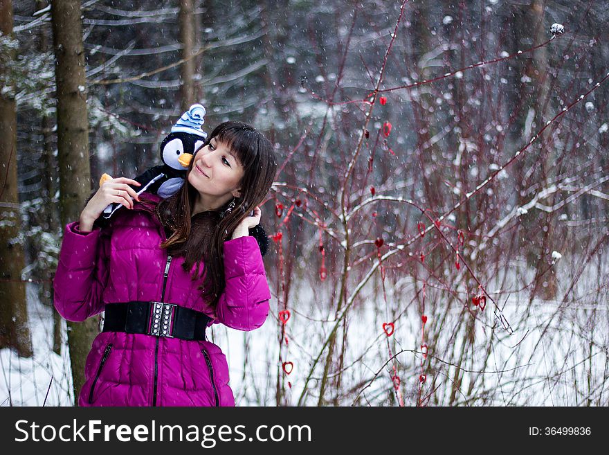 Portrait of beautiful woman in snow winter forest