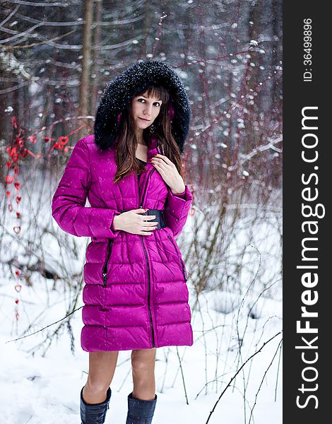 Portrait of beautiful woman in snow winter forest