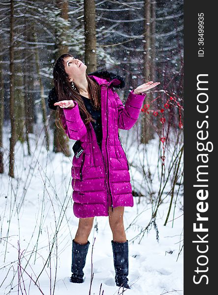 Portrait of beautiful woman in snow winter forest