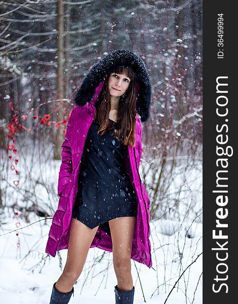 Portrait of beautiful woman in snow winter forest