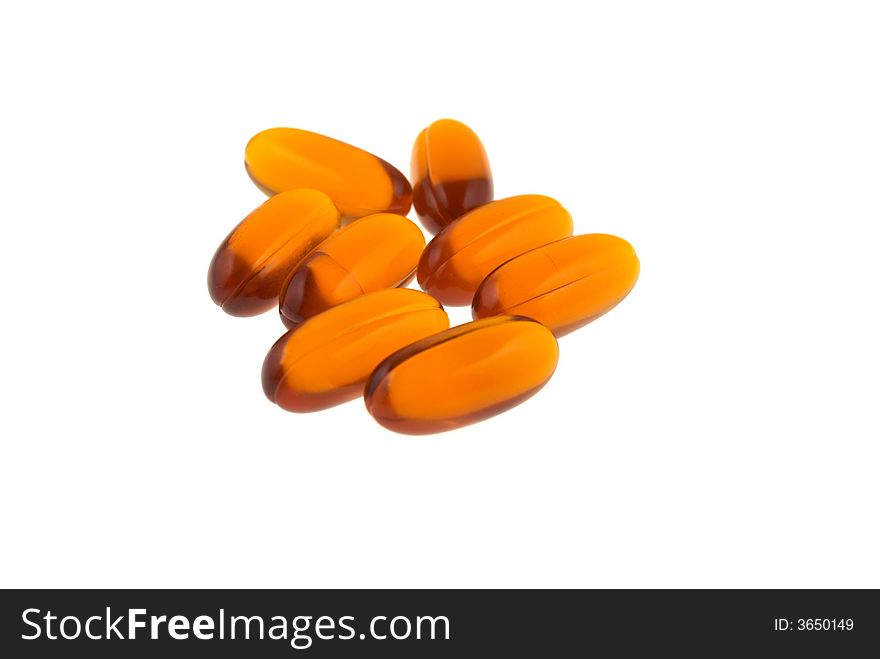 Orange pills in a white background