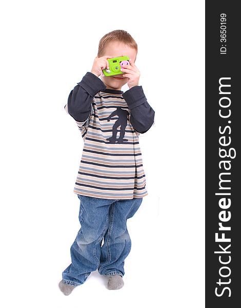 Young photographer and his toy on the white background