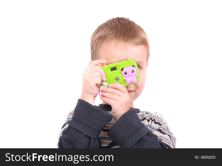 Young photographer and his toy on the white background