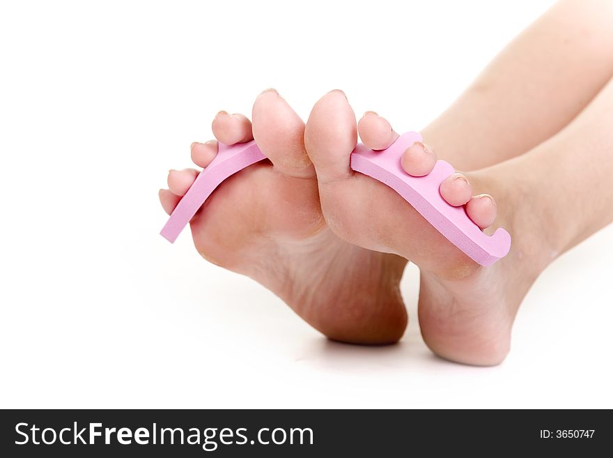 Foot care shot with woman feet over white background. Foot care shot with woman feet over white background