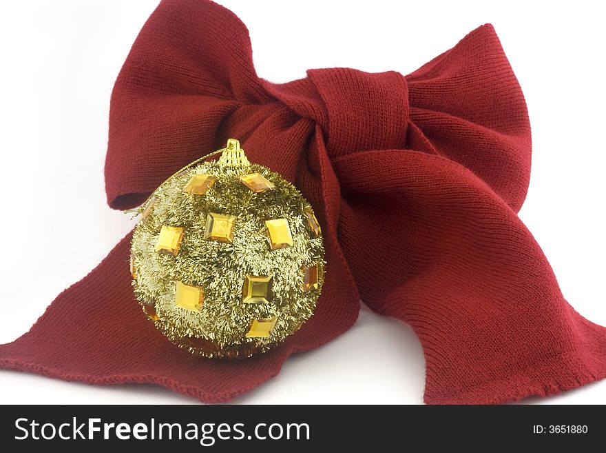 Gold christmas bauble with red ribbon, isolated on white. Gold christmas bauble with red ribbon, isolated on white