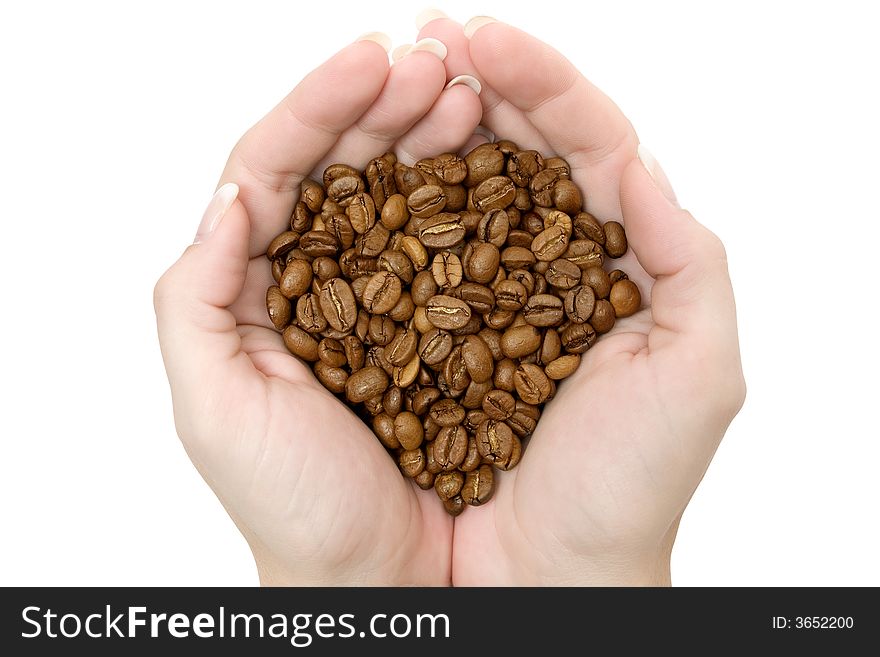 Handful of coffee beans isolated on a white background.