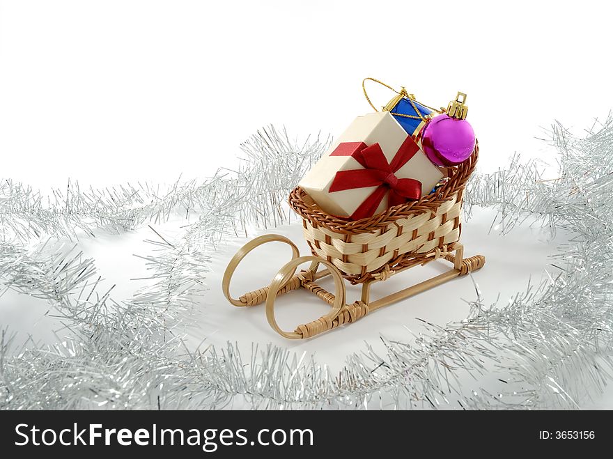 Santa's sledge with gift box and christmas ornaments. Santa's sledge with gift box and christmas ornaments