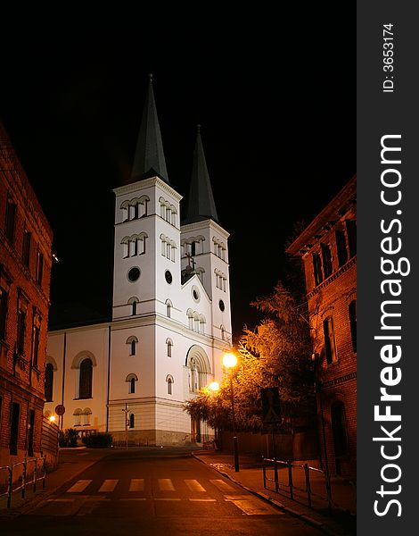 The Gothic Revival church by night.