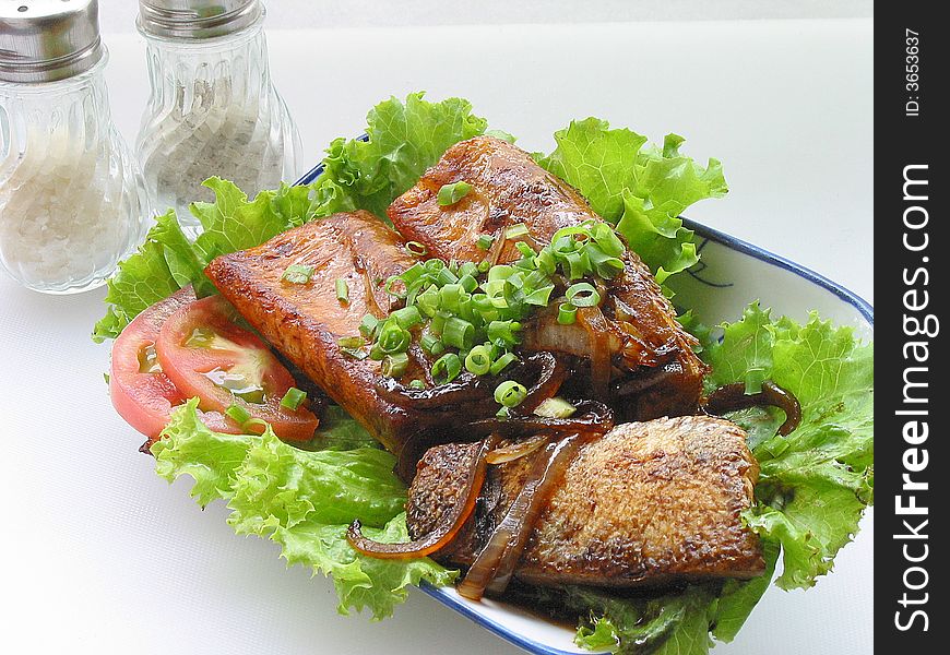 Sushi on the white background. Salmon barbecue after being placed on disk yard, captioned pepper