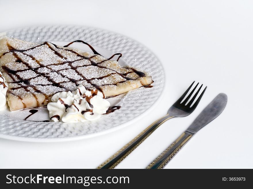 Pancake With Chocolate and cream on plate