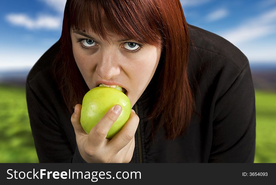 Redhead girl biting on a delicious green apple with a flirtatious look.

Shot in studio. Redhead girl biting on a delicious green apple with a flirtatious look.

Shot in studio.